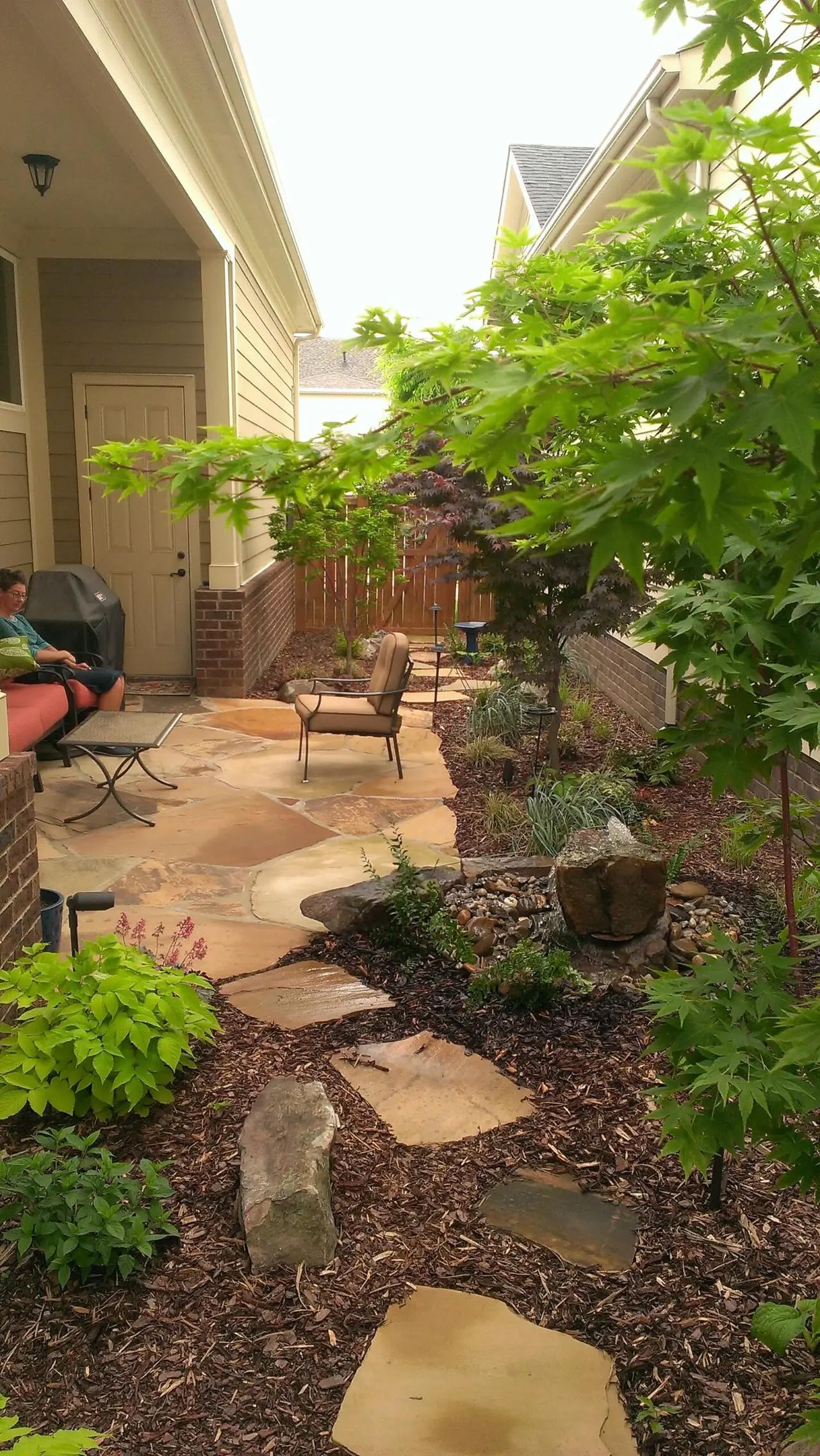 A flagstone path through shade plantings