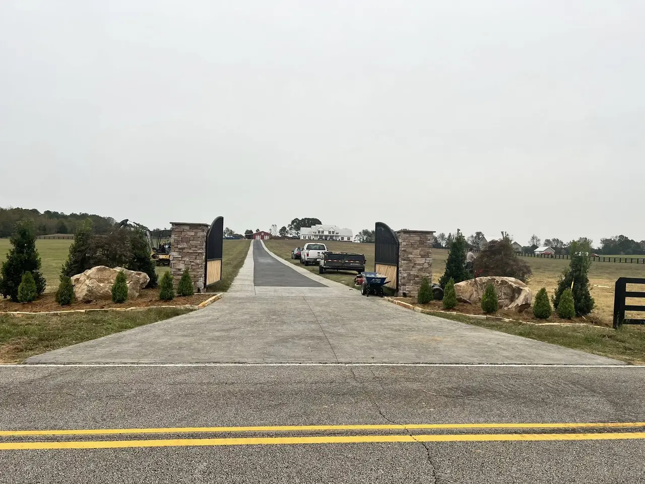 A long entry drive framed by stone pillars