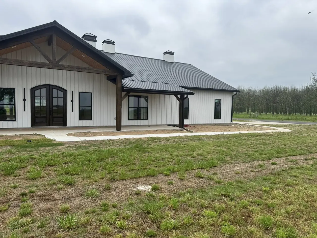 New beds along the front of a farmhouse