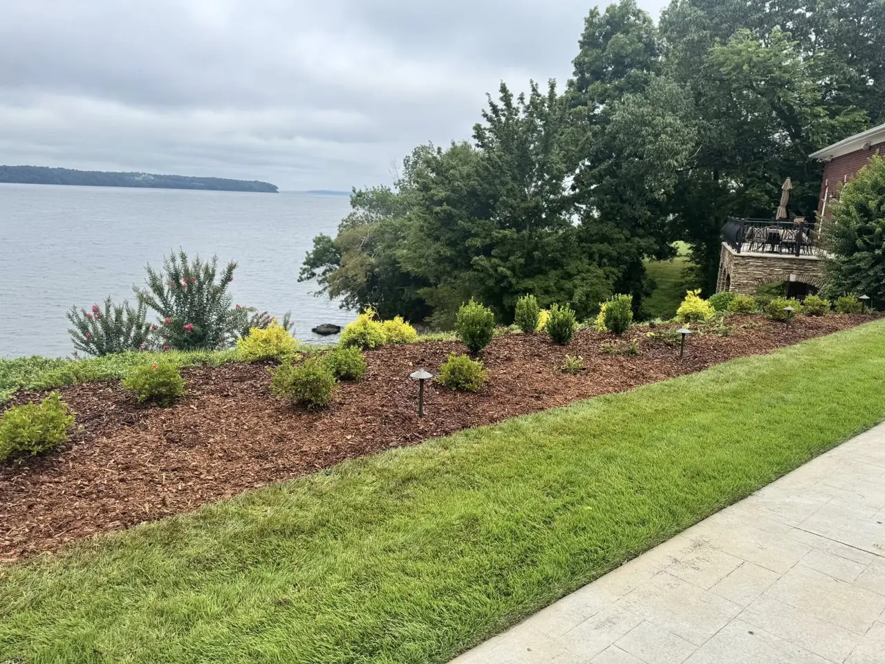 Planted beds along a lakefront slope