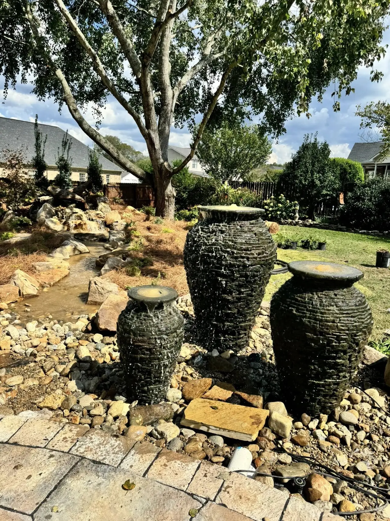 Two urn fountains at the head of a pondless stream